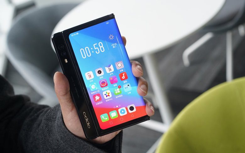 Man Showing New Oppo Foldable Smartphone