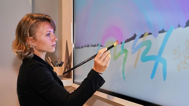 A Women is Painting at Samsung Flip Display