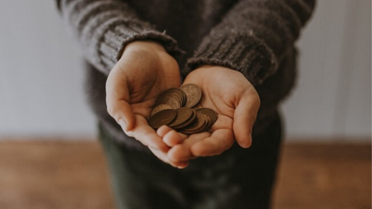 Child Holding Coins