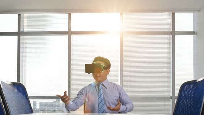 A Man Using Virtual Reality Headsets