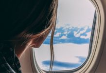 Woman Seeing Outside Airplane Window